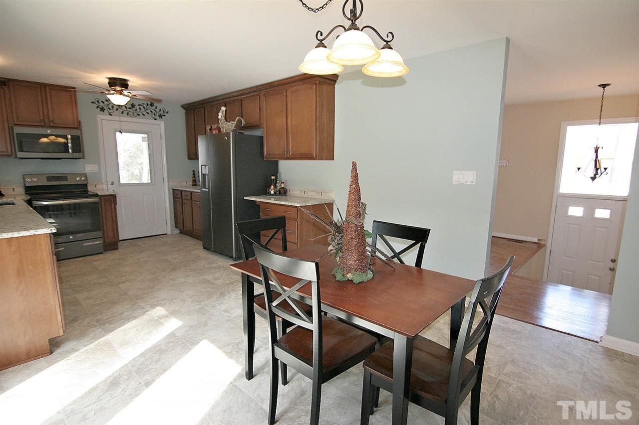3404 Victor Place Raleigh, NC 27604 - Photo 4 of 22 a view of a dining room with furniture and wooden floor