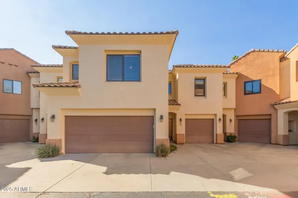 a front view of a house with a garage