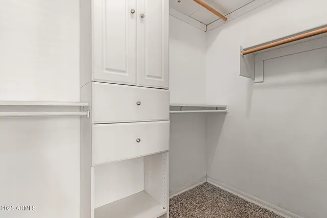 a view of storage and utility room with closet