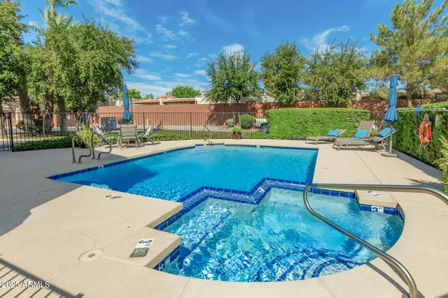 a view of a swimming pool from a lounge chair