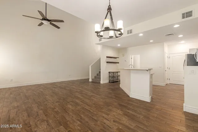 a view of a kitchen with a sink stainless steel appliances and cabinets