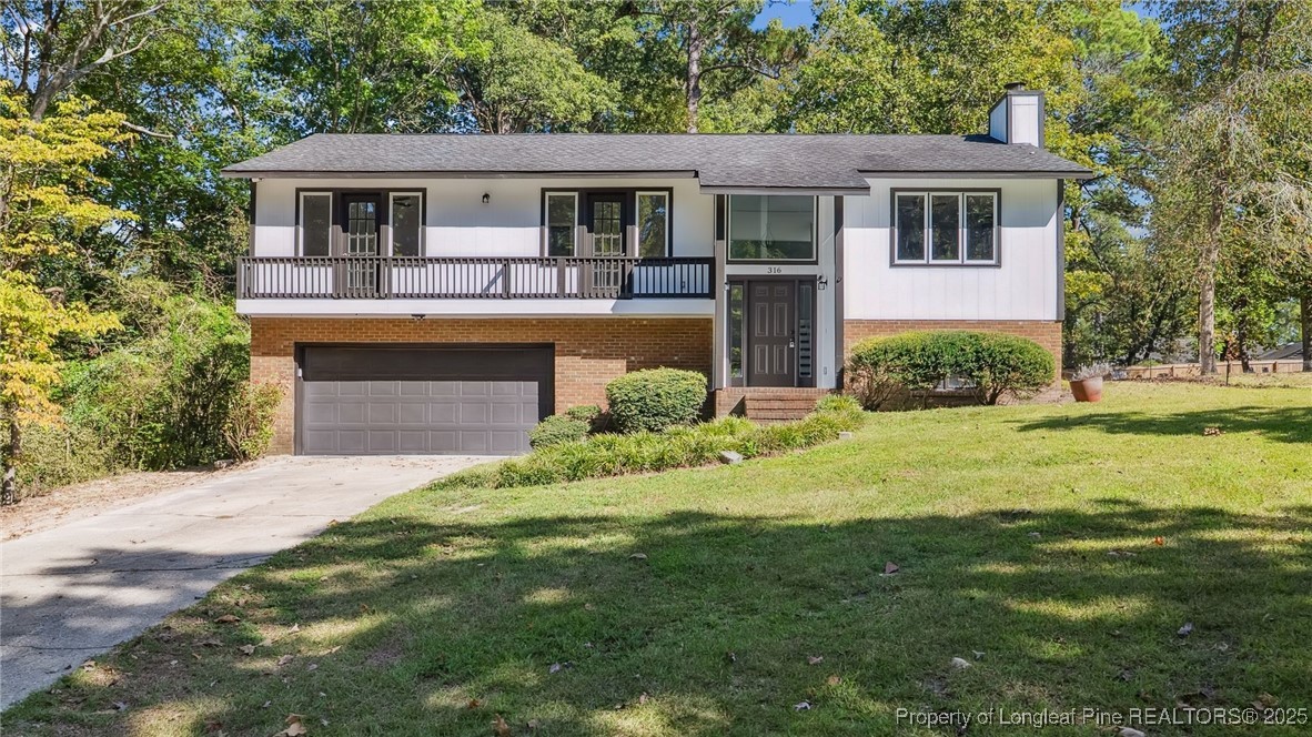 316 Patterson Street Raeford, NC 28376 - Photo 1 of 39 a front view of a house with a yard