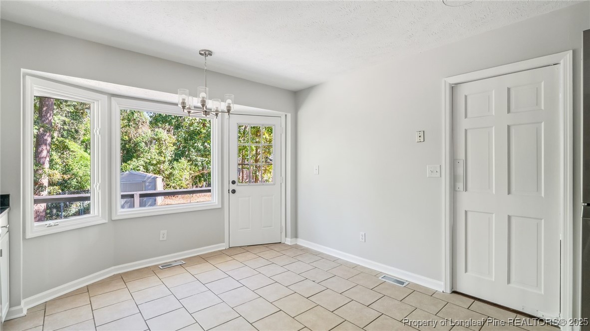 316 Patterson Street Raeford, NC 28376 - Photo 15 of 39 an empty room with windows