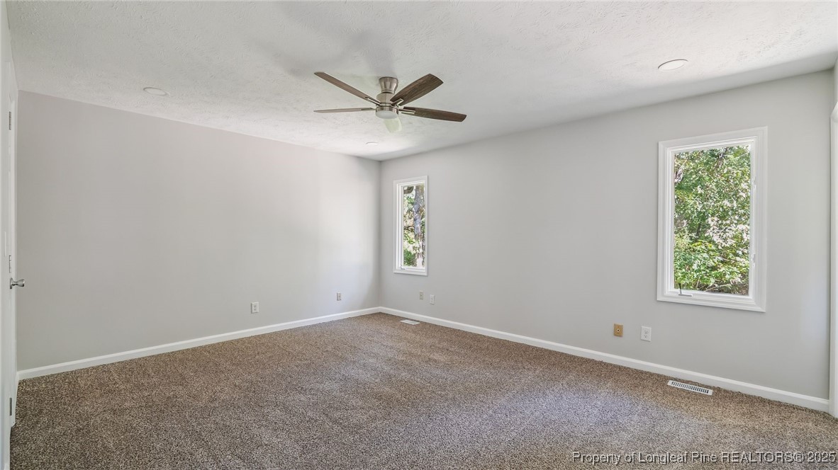 316 Patterson Street Raeford, NC 28376 - Photo 16 of 39 a view of an empty room with a window