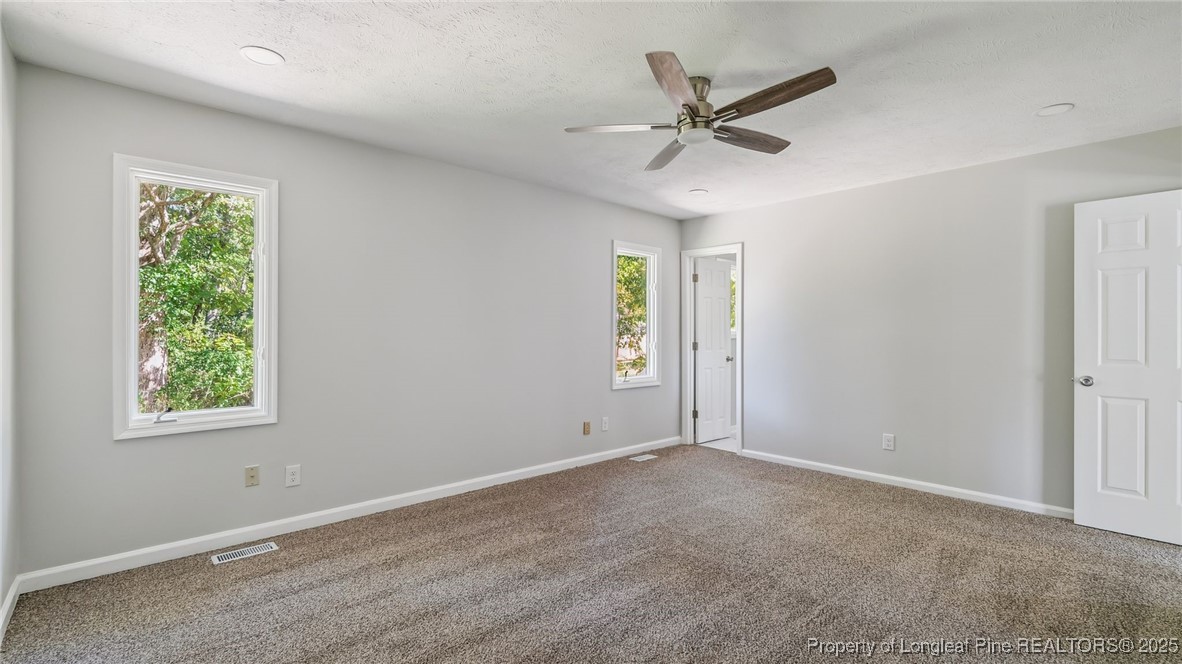 316 Patterson Street Raeford, NC 28376 - Photo 17 of 39 an empty room with window and ceiling fan