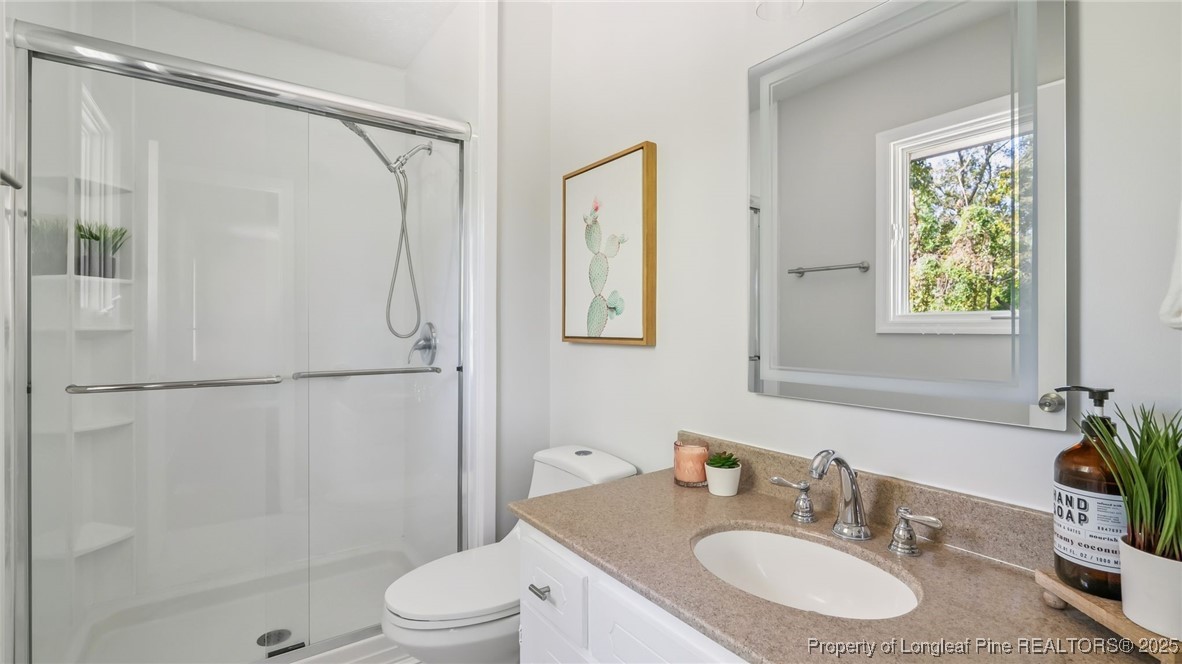 316 Patterson Street Raeford, NC 28376 - Photo 19 of 39 a bathroom with a sink toilet and shower