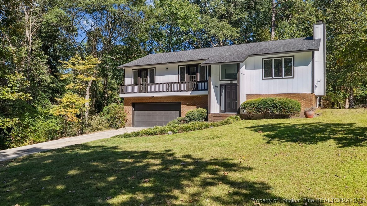 316 Patterson Street Raeford, NC 28376 - Photo 2 of 39 a front view of a house with a yard