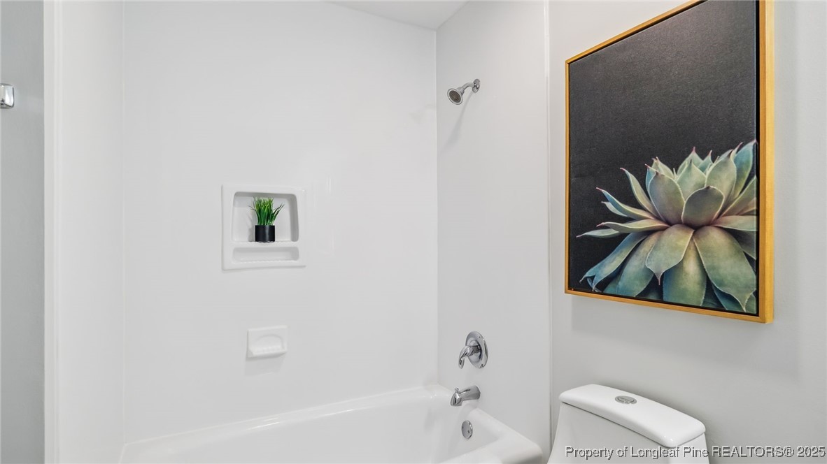 316 Patterson Street Raeford, NC 28376 - Photo 23 of 39 a bathroom with a toilet and a shower