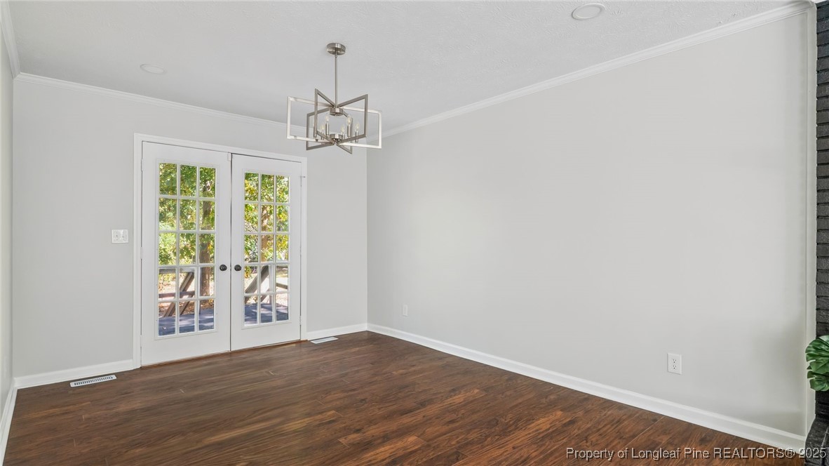 316 Patterson Street Raeford, NC 28376 - Photo 8 of 39 wooden floor in an empty room with a window