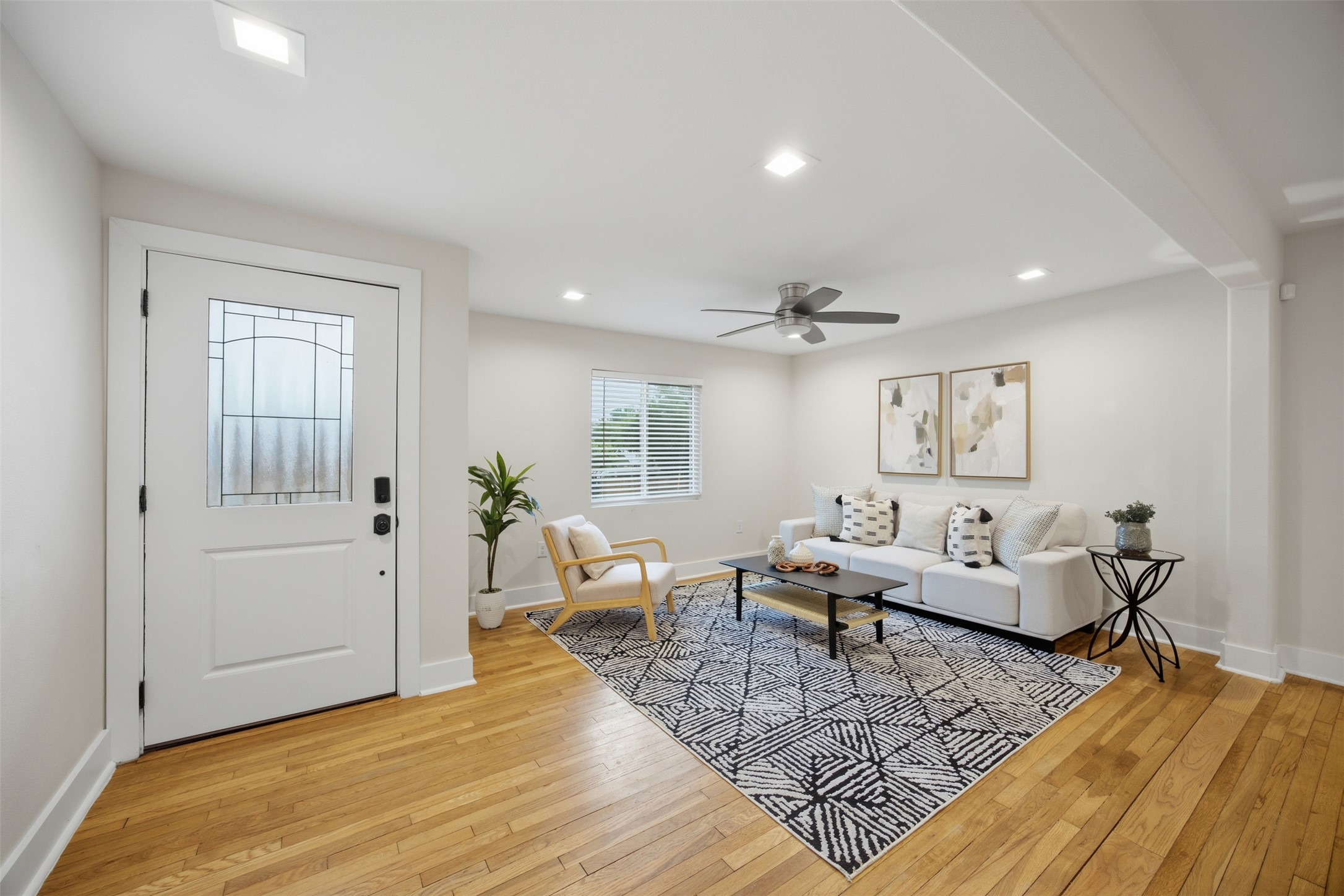 5116 Heflin Lane, Unit 1 Austin, TX 78721 - Photo 6 of 35 Hardwood floors stretch across this living space, offering warmth and continuity.