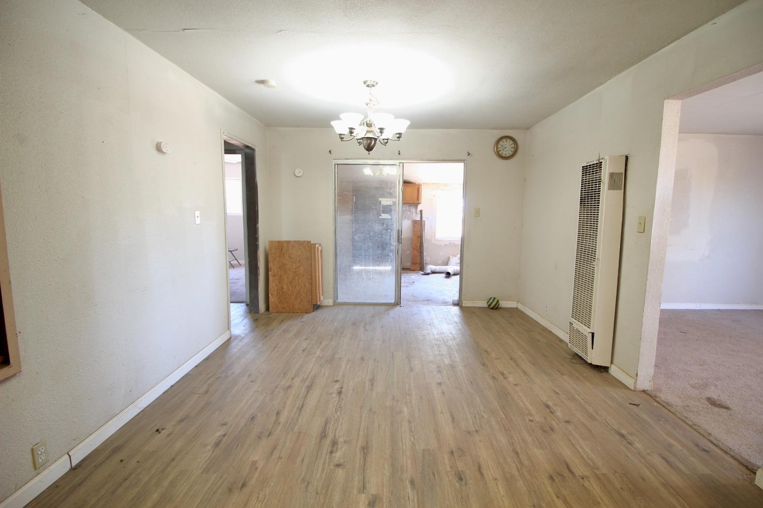 16896 Road 400 Madera, CA 93636 - Photo 11 of 34 wooden floor in an empty room with a window