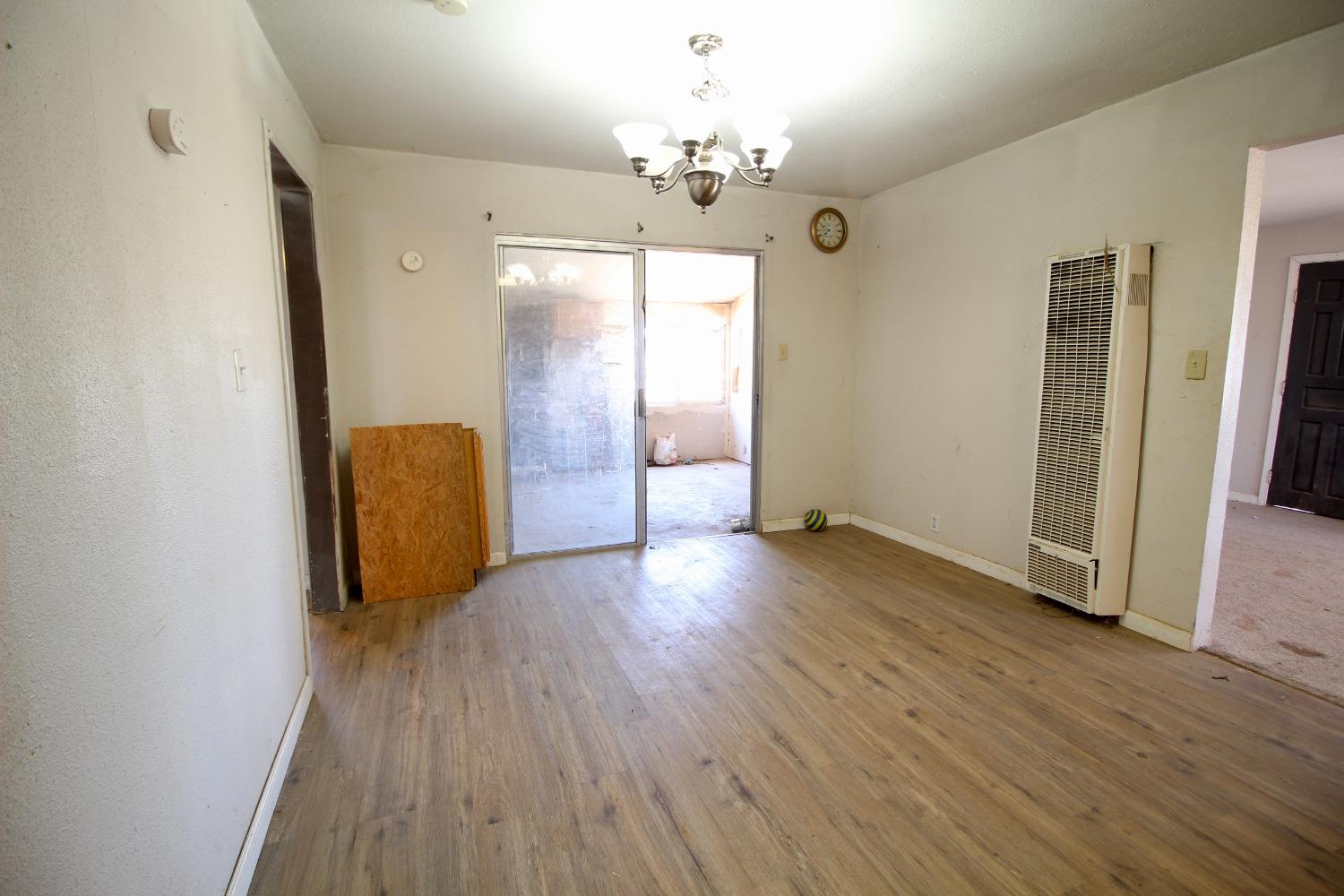 16896 Road 400 Madera, CA 93636 - Photo 12 of 34 a view of an empty room with wooden floor and a window