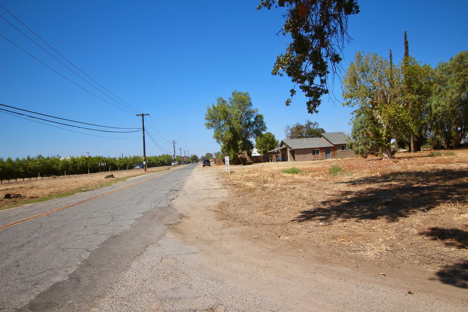 16896 Road 400 Madera, CA 93636 - Photo 26 of 34 a view of a road with a building in the background