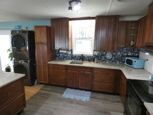 a bathroom with a sink double vanity and a mirror