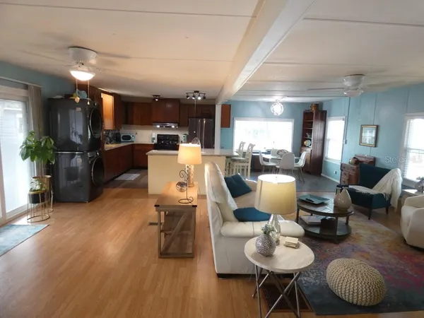 a view of a porch with furniture and a yard