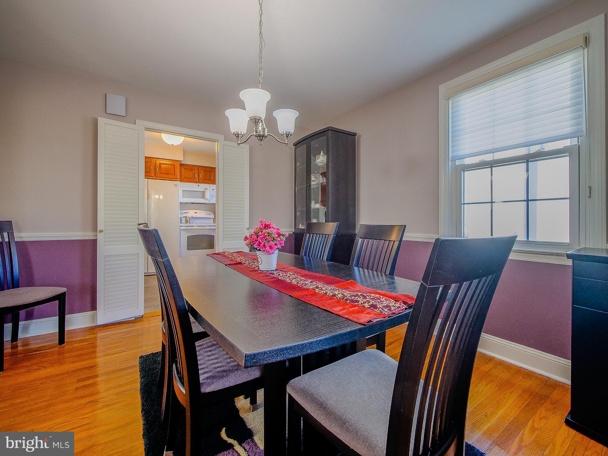 204 East Thomson Avenue Springfield, PA 19064 - Photo 16 of 58 a view of a dining room with furniture and wooden floor