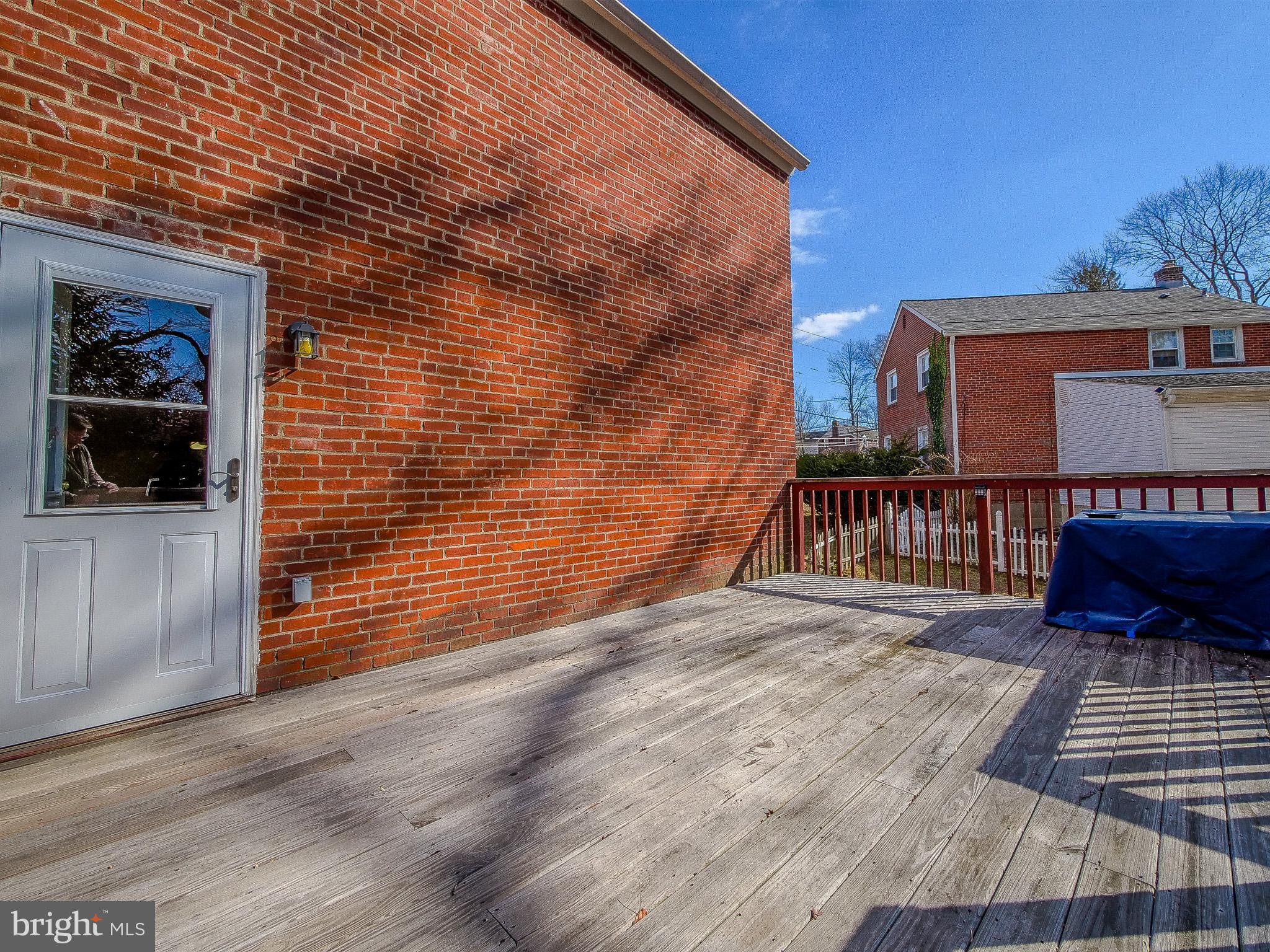 204 East Thomson Avenue Springfield, PA 19064 - Photo 24 of 58 a view of a balcony with wooden floor and a potted plant