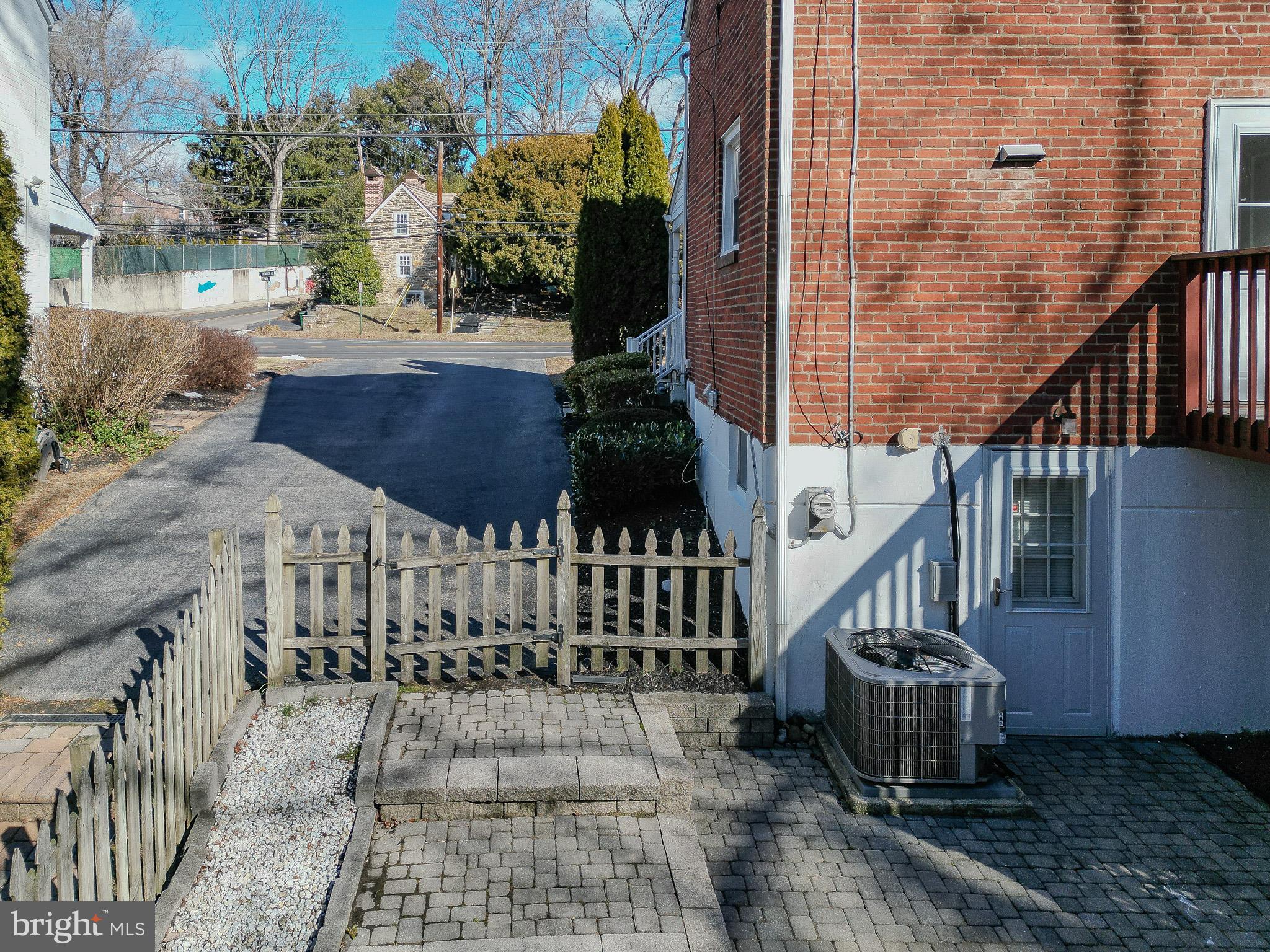 204 East Thomson Avenue Springfield, PA 19064 - Photo 28 of 58 a view of a brick house with wooden fence