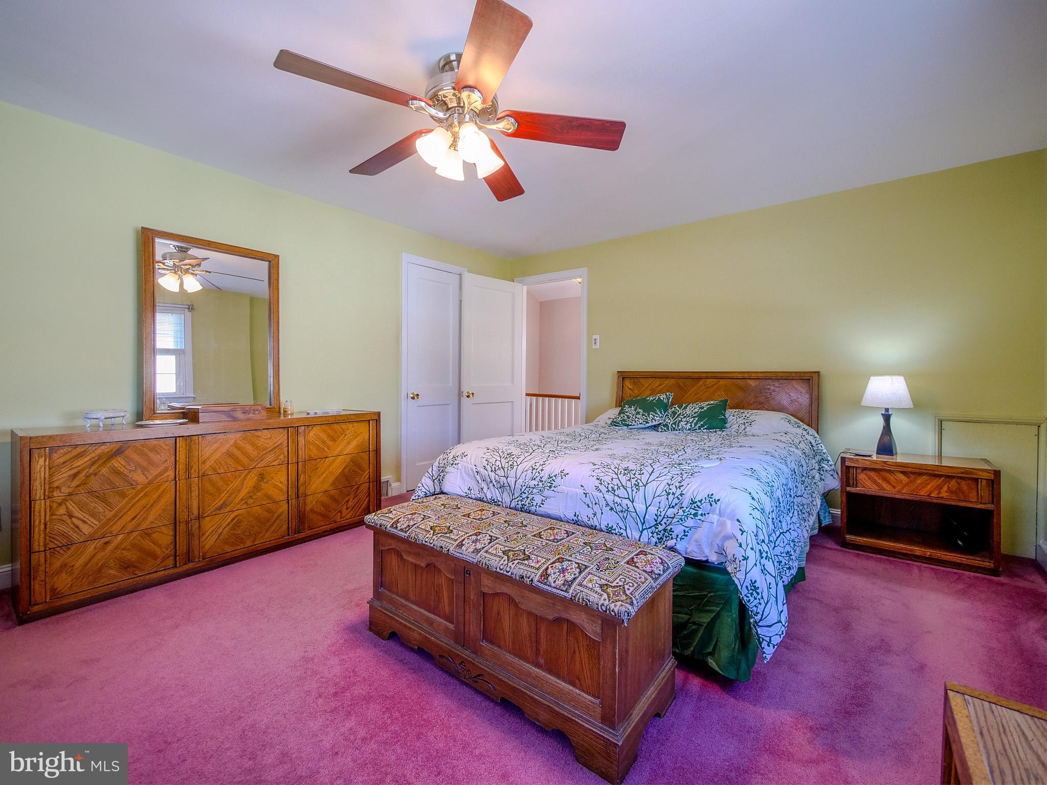 204 East Thomson Avenue Springfield, PA 19064 - Photo 31 of 58 a bedroom with a bed and a chandelier