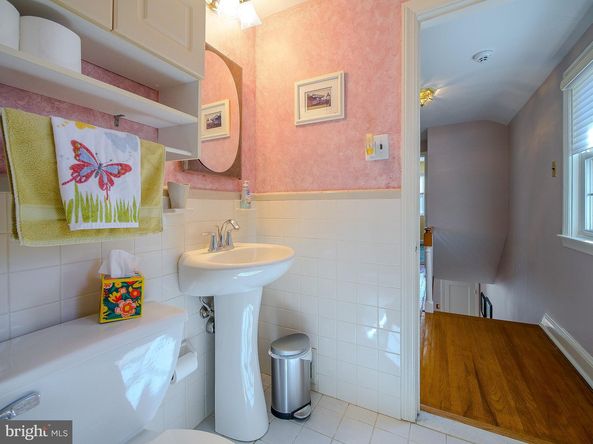 204 East Thomson Avenue Springfield, PA 19064 - Photo 34 of 58 a bathroom with a sink and a mirror