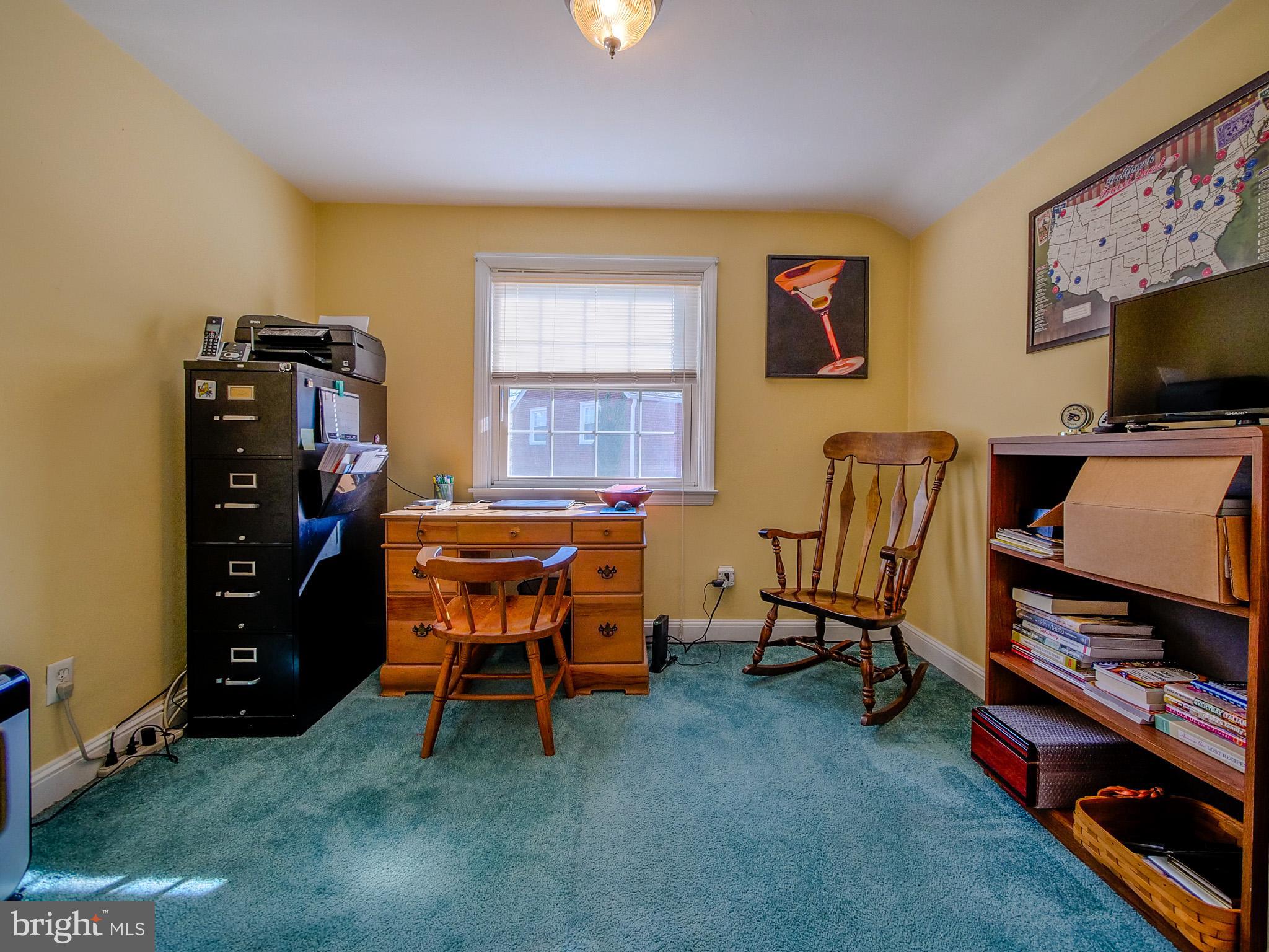 204 East Thomson Avenue Springfield, PA 19064 - Photo 38 of 58 a room with furniture and a flat screen tv
