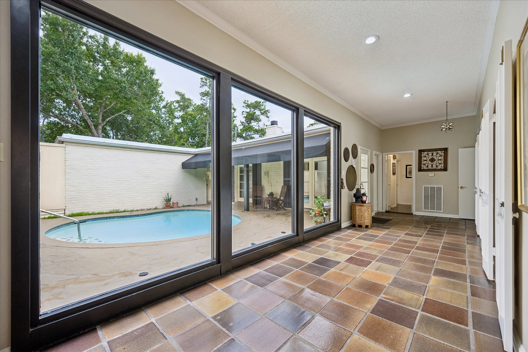 306 Gessner Road Bunker Hill Village, TX 77024 - Photo 5 of 41 Floor to ceiling windows with expansive views of the pool.