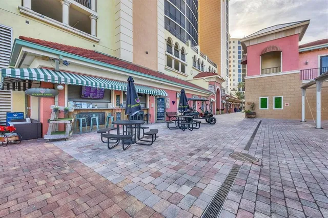 a view of swimming pool with outdoor seating