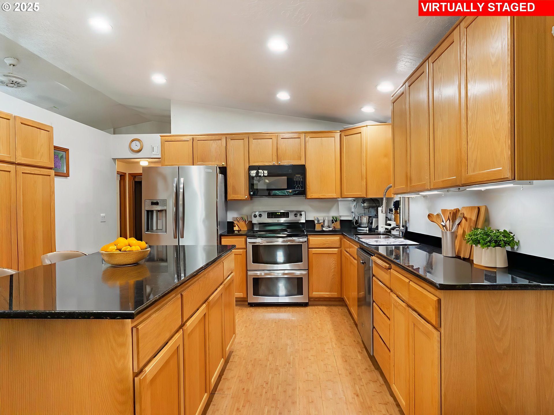 19791 Northeast Sunnycrest Road Newberg, OR 97132 - Photo 8 of 40 a kitchen with stainless steel appliances granite countertop a refrigerator and a stove top oven