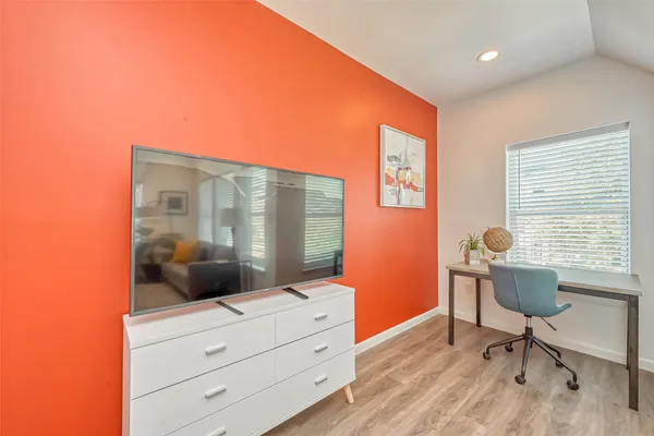 a workspace with furniture and window