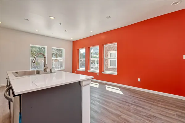 a room with wooden floor and window
