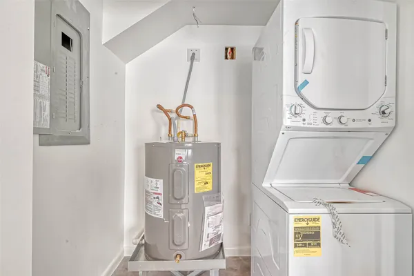 a view of a livingroom with furniture and windows