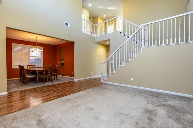 a view of a livingroom with furniture and dining table