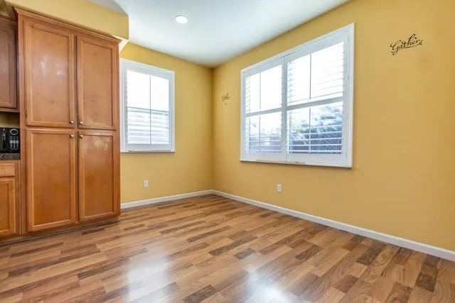 a living room with furniture windows and a fireplace