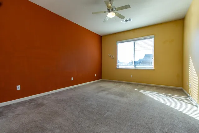 a view of a door and brick walls