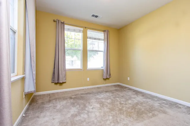 an empty room with closet area