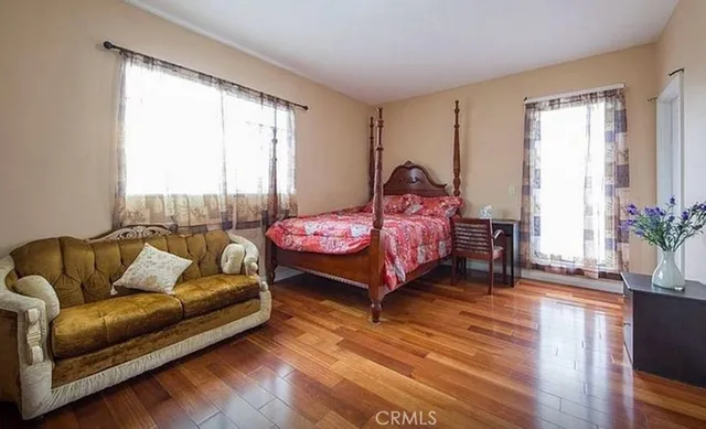 a bed room with a bed and a couch