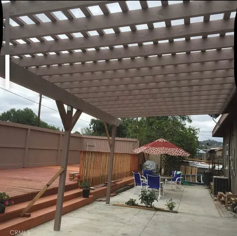 a patio with a patio table and chairs