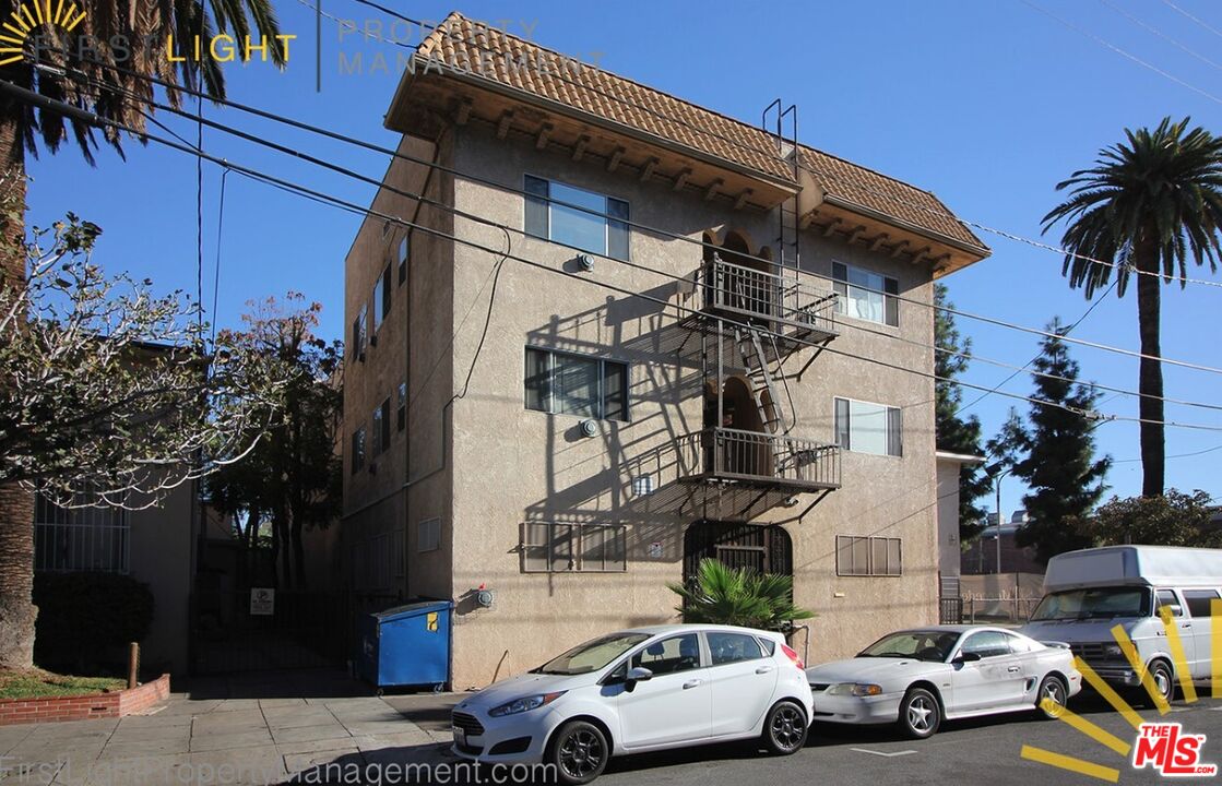 647 West 18th Street, Unit 316 Los Angeles, CA 90015 - Photo 8 of 8 a view of cars parked in front of a house