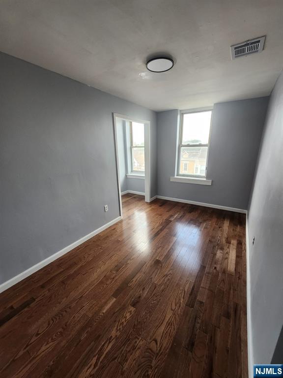 316 South Orange Avenue, Unit 2N Newark, NJ 07103 - Photo 2 of 10 a view of wooden floor and windows in a room