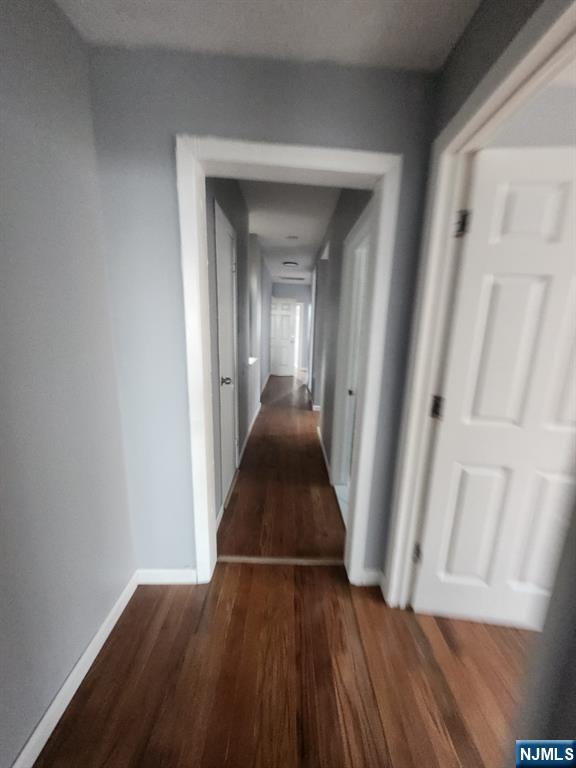 316 South Orange Avenue, Unit 2N Newark, NJ 07103 - Photo 6 of 10 a view of a hallway view with wooden floor and staircase