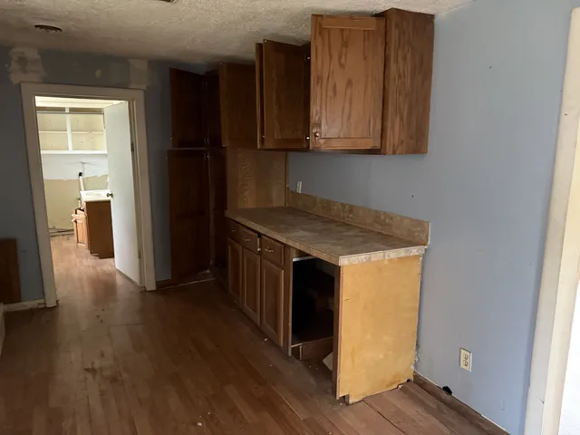 a kitchen with wooden cabinets and a sink