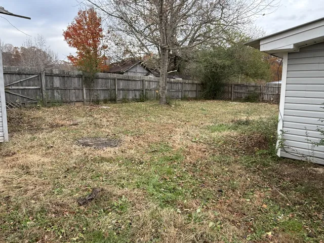 a backyard of a house with lots of green space