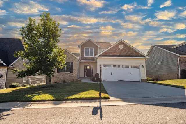 a view of house with yard