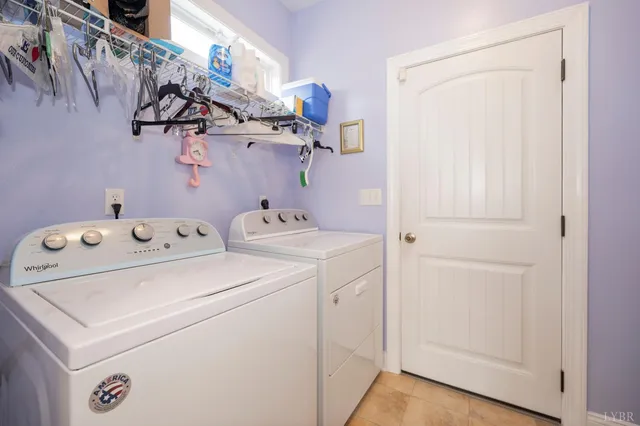 a bed room with a bed and a chandelier