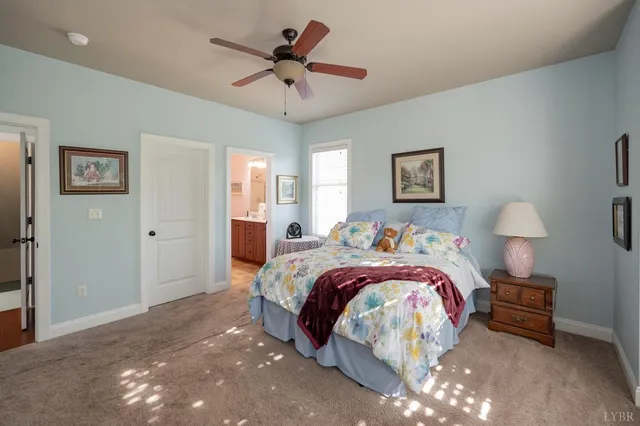 a bathroom with a double vanity sink mirror and toilet