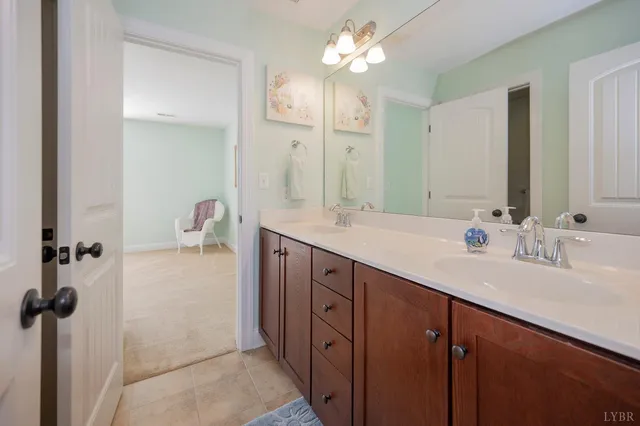a bathroom with a toilet and a shower curtain