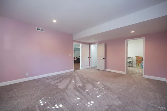 a view of a workspace with furniture and wooden floor