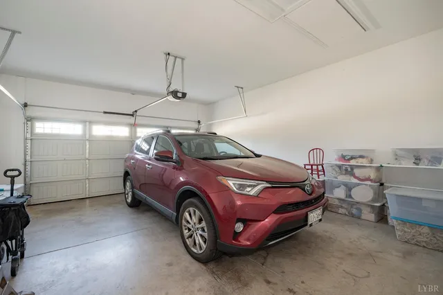 an aerial view of a house with a yard basket ball court and outdoor seating
