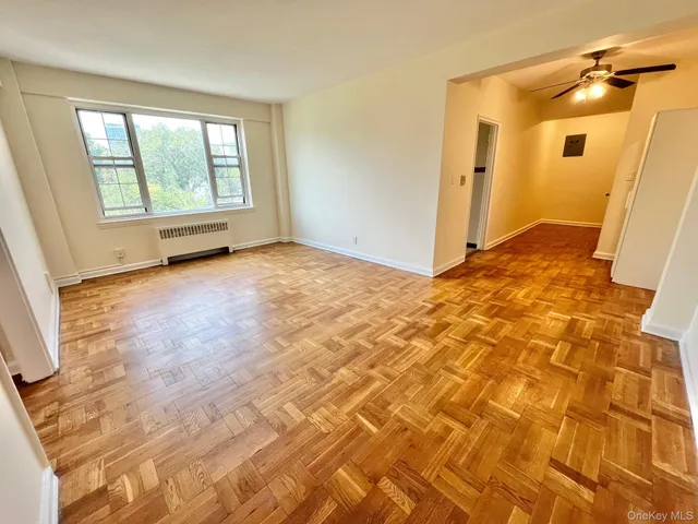 a view of an empty room with a window