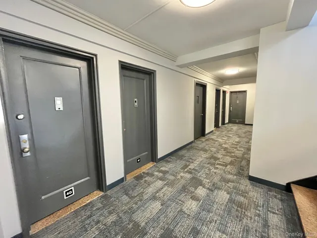 a view of a room with wooden floor and cabinet